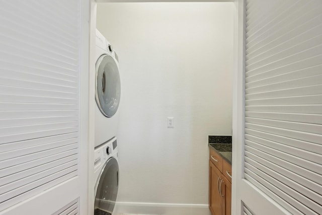 laundry room featuring stacked washer and dryer