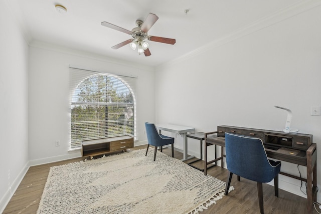 office area featuring hardwood / wood-style flooring, ornamental molding, and ceiling fan