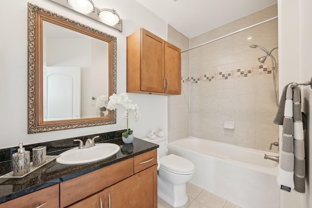 full bathroom featuring tile patterned floors, vanity, toilet, and tiled shower / bath combo