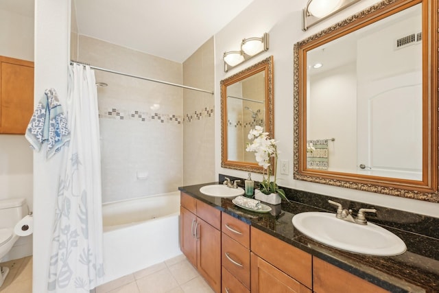 full bathroom featuring shower / tub combo with curtain, vanity, toilet, and tile patterned flooring