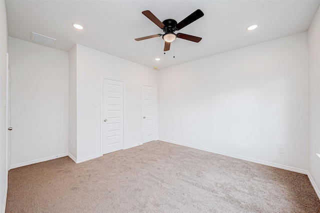 unfurnished bedroom featuring carpet and ceiling fan