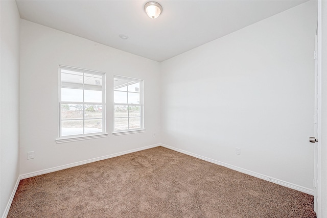 unfurnished room featuring carpet flooring