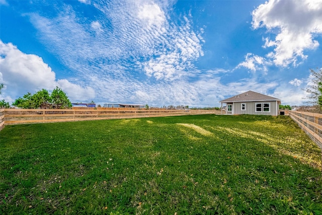 view of yard with a rural view