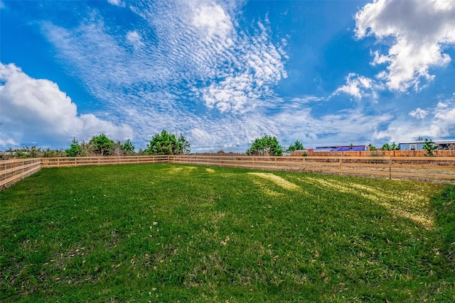 view of yard with a rural view