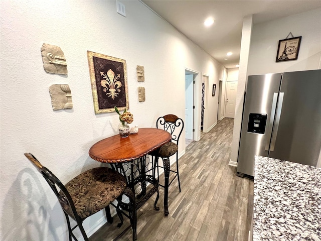 dining space featuring hardwood / wood-style floors