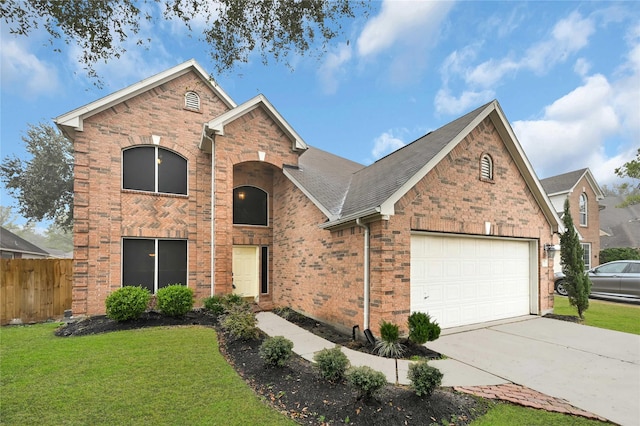 view of front of home featuring a garage and a front yard