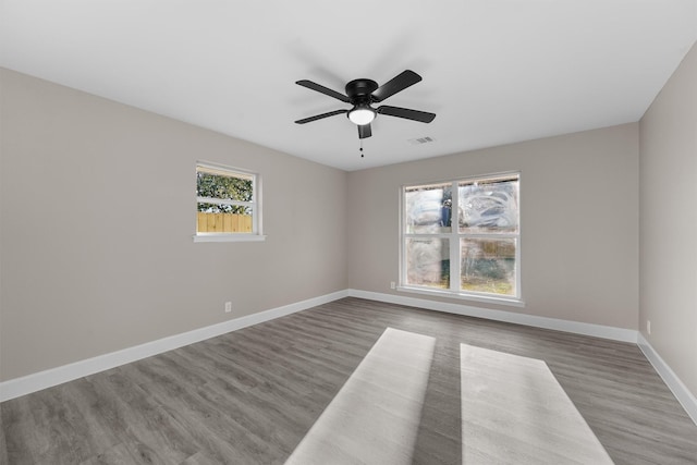 empty room featuring wood-type flooring and ceiling fan