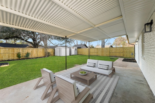 view of patio featuring outdoor lounge area and a storage unit