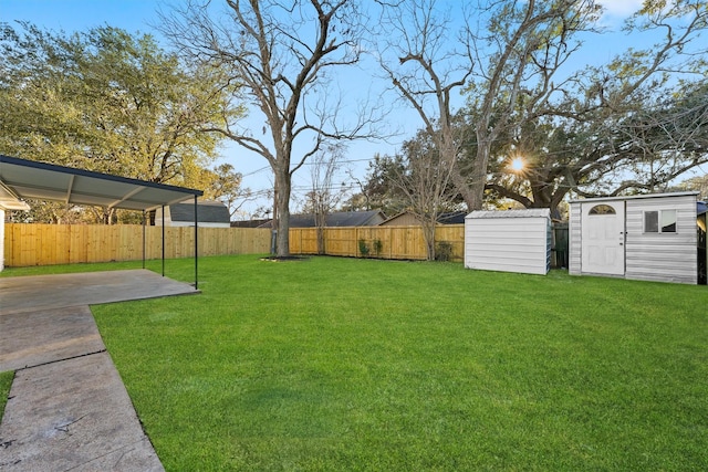 view of yard with a storage shed and a patio