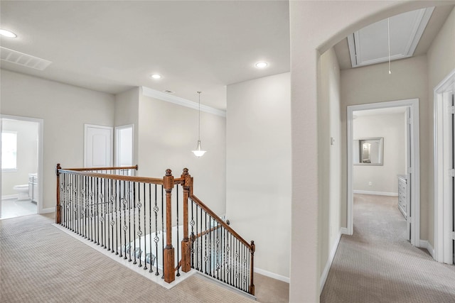 hallway with light colored carpet