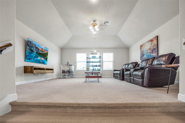 carpeted living room featuring vaulted ceiling and ceiling fan