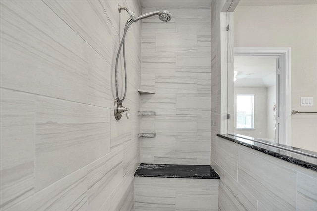 bathroom with tiled shower