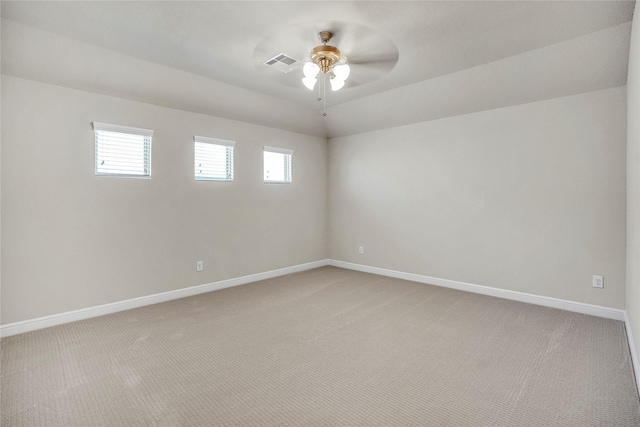 carpeted empty room featuring ceiling fan