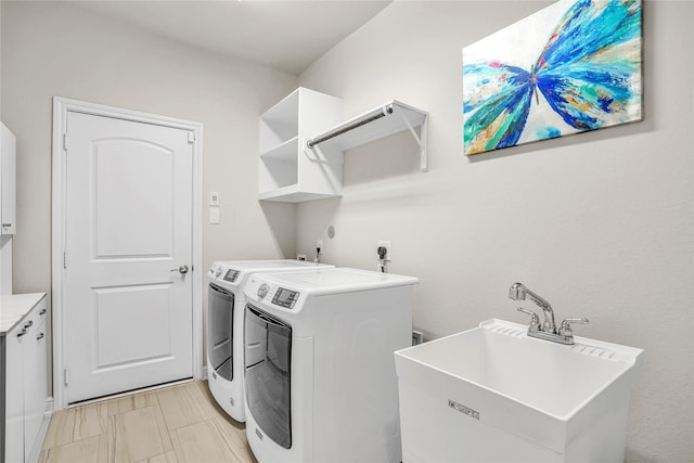 laundry area with sink and washer and dryer