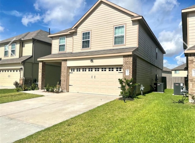 view of front facade with a garage, central AC, and a front yard