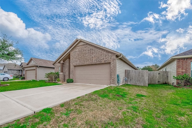 view of front of home with a garage and a front yard