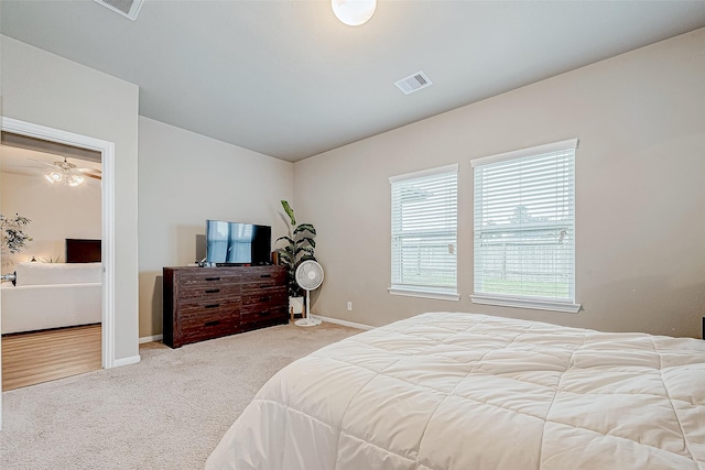 bedroom featuring lofted ceiling and carpet floors