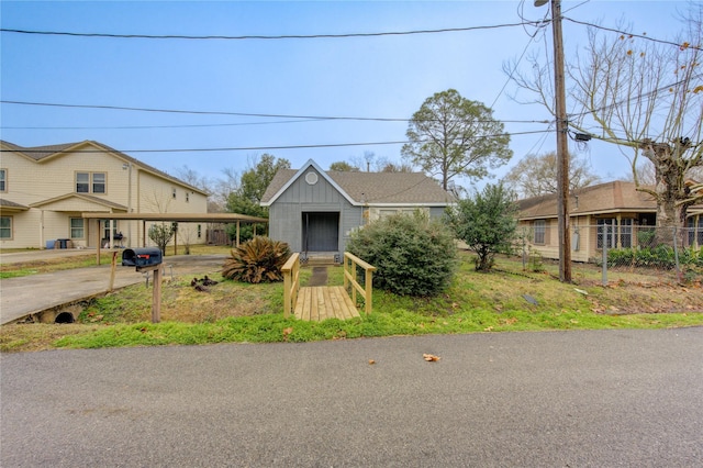 view of front of home featuring a carport