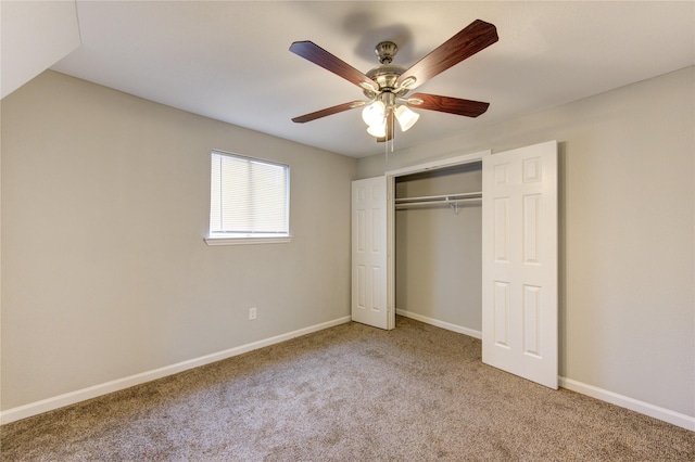 unfurnished bedroom with ceiling fan, carpet floors, and a closet