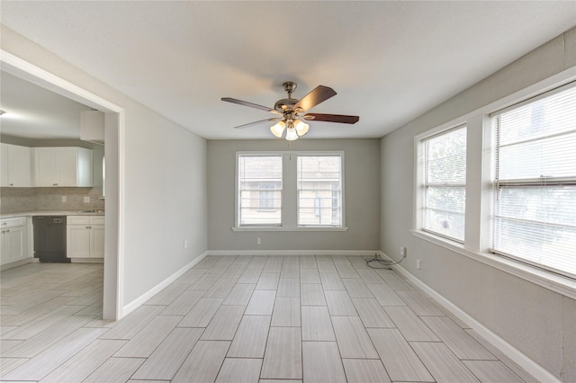 spare room with ceiling fan