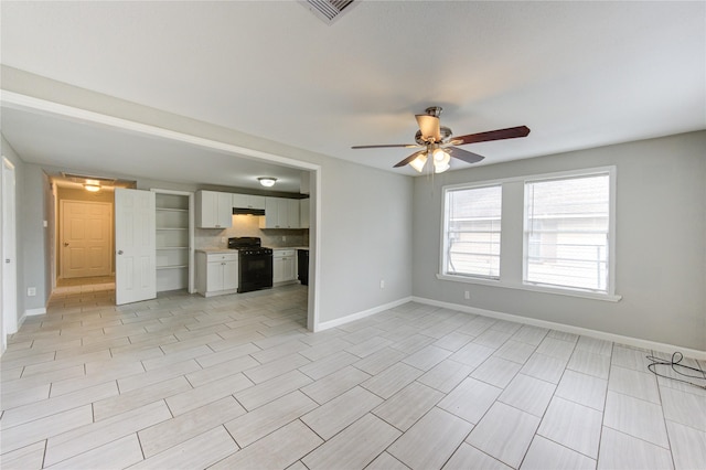 unfurnished living room featuring ceiling fan