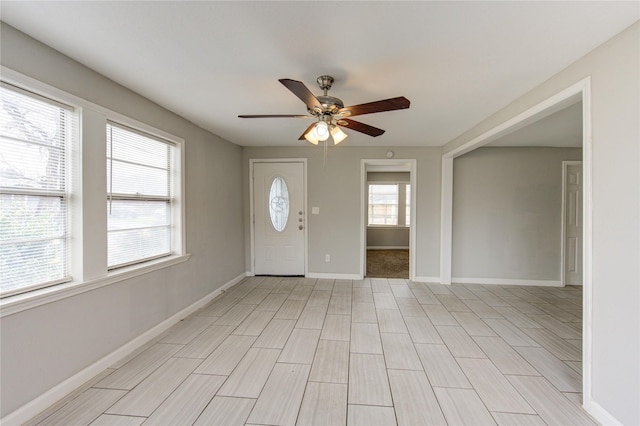 entryway featuring ceiling fan