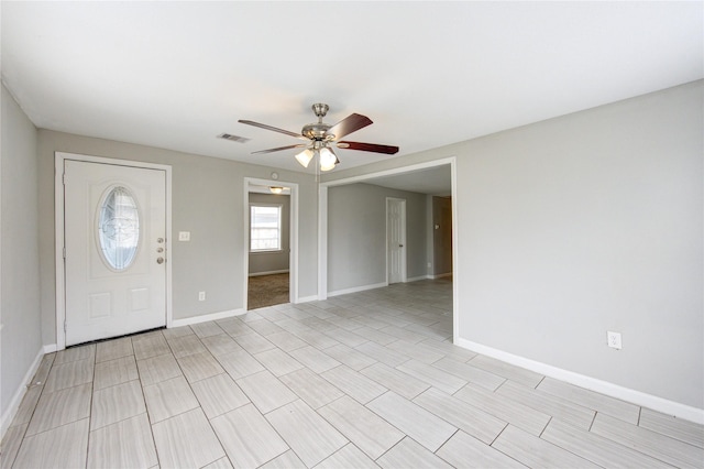 foyer featuring ceiling fan