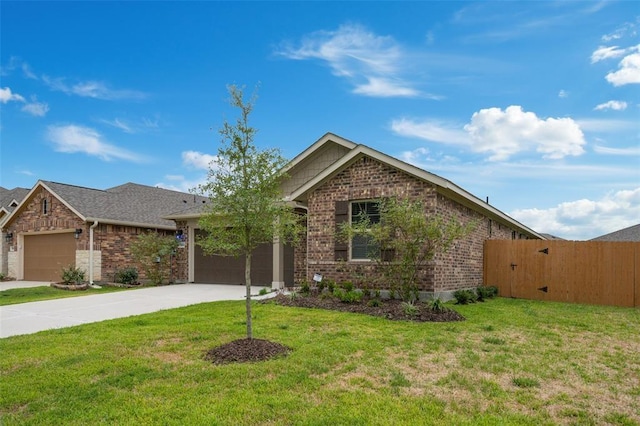 view of front of house featuring a garage and a front yard