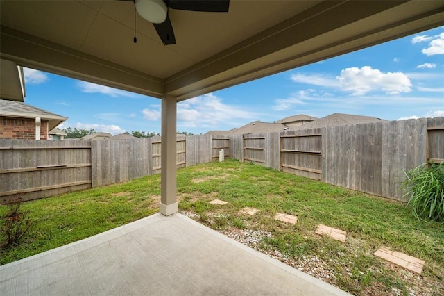 view of yard with a patio and ceiling fan