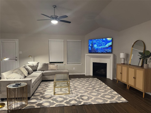 living room featuring ceiling fan, lofted ceiling, and dark hardwood / wood-style floors