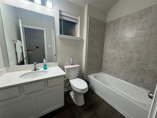 full bathroom featuring vanity, toilet, and tiled shower / bath combo