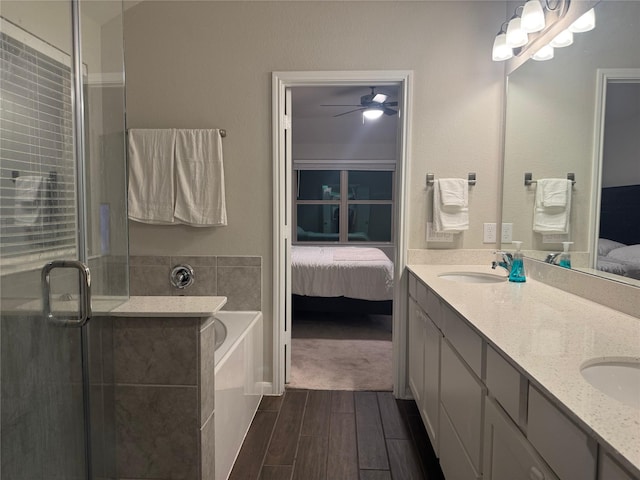 bathroom featuring vanity, shower with separate bathtub, and ceiling fan