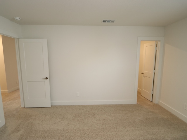 17322 Silver Birch Ct, New Caney, TX 77357 - spare room with light colored carpet, baseboards, and a smoke detector