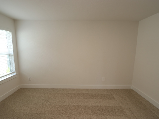 17322 Silver Birch Ct, New Caney, TX 77357 - unfurnished room featuring light colored carpet and baseboards