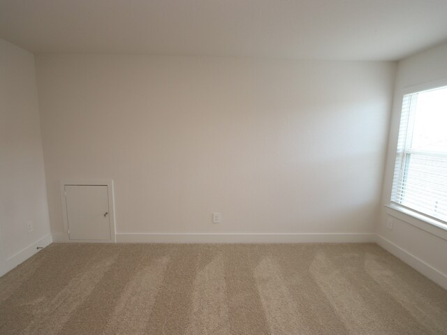 17322 Silver Birch Ct, New Caney, TX 77357 - unfurnished room featuring light carpet and baseboards