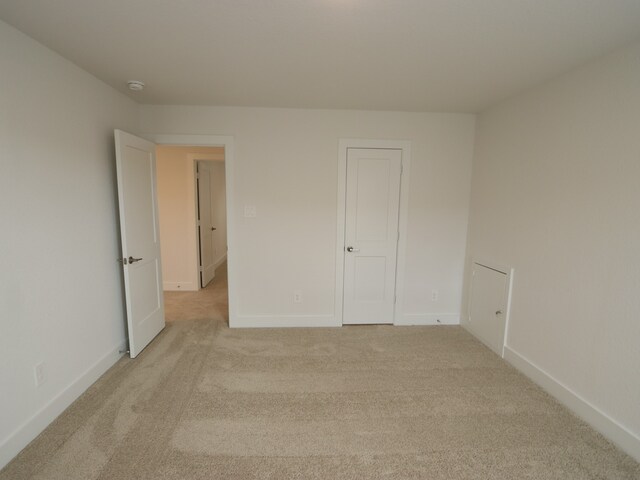 17322 Silver Birch Ct, New Caney, TX 77357 - unfurnished bedroom with light colored carpet and baseboards