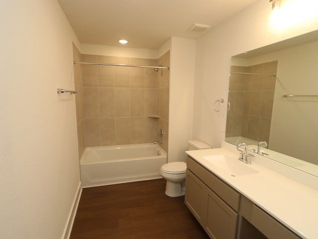 17322 Silver Birch Ct, New Caney, TX 77357 - bathroom with toilet, wood finished floors, vanity, shower / washtub combination, and recessed lighting