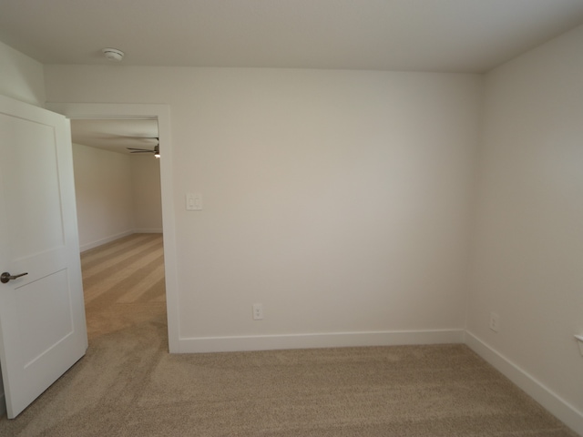 17322 Silver Birch Ct, New Caney, TX 77357 - empty room featuring light carpet, a smoke detector, and baseboards