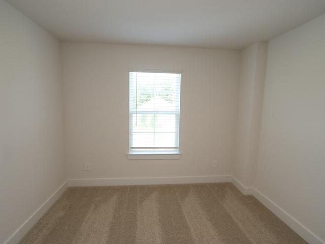 17322 Silver Birch Ct, New Caney, TX 77357 - spare room with light colored carpet and baseboards