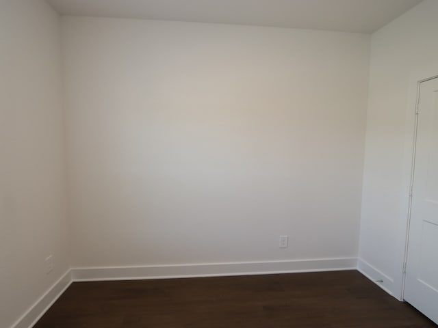 17322 Silver Birch Ct, New Caney, TX 77357 - empty room featuring dark wood-style flooring and baseboards