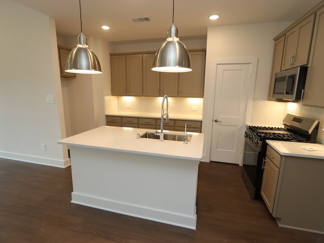 17322 Silver Birch Ct, New Caney, TX 77357 - kitchen featuring range with gas stovetop, a sink, stainless steel microwave, light countertops, and backsplash