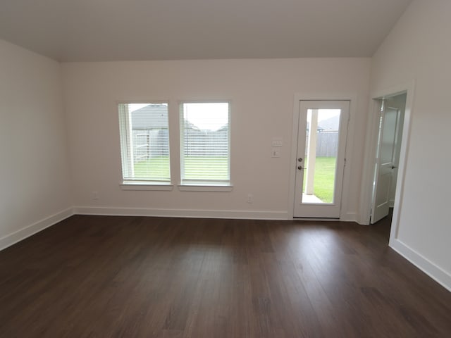 17322 Silver Birch Ct, New Caney, TX 77357 - unfurnished room with plenty of natural light, dark wood-style floors, and baseboards