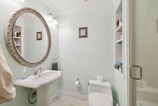 bathroom featuring sink, crown molding, tile patterned flooring, a shower with shower door, and toilet