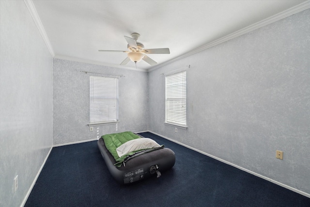 unfurnished room featuring ceiling fan, ornamental molding, and carpet floors