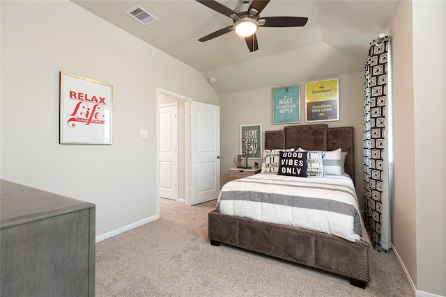 carpeted bedroom with vaulted ceiling and ceiling fan