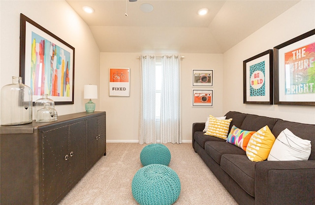 carpeted living room featuring lofted ceiling