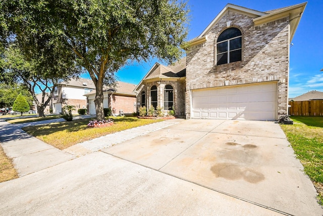 view of front property with a garage and a front yard