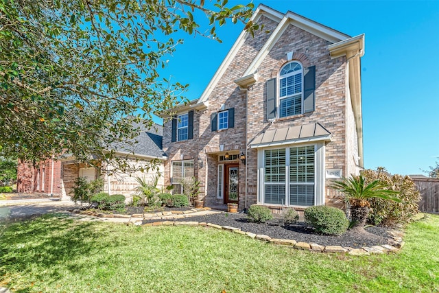 view of front of home with a front lawn