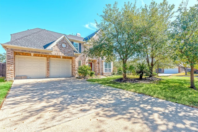 view of front facade featuring a garage and a front yard