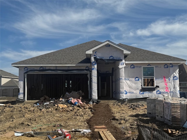 back of house with a garage